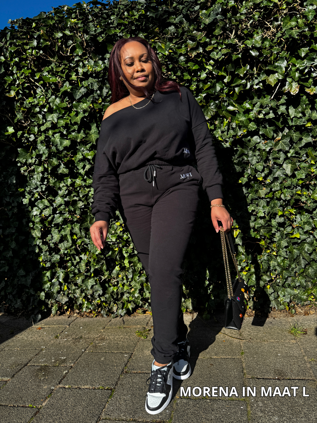 Off-shoulder joggingpak voor dames in zwart met comfortabele pasvorm